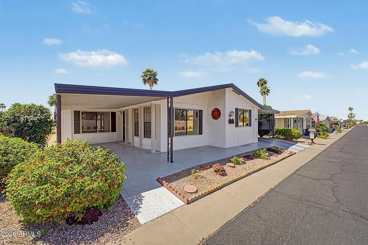 Street view of the home and carport in Palmas del Sol, Mesa AZ