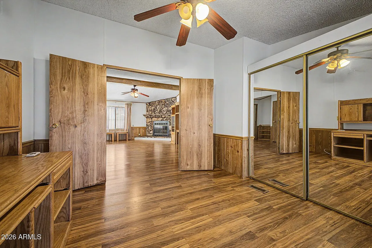 Room with built-in wood cabinetry and a window