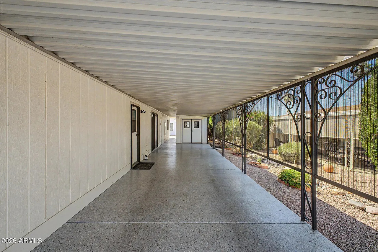 Covered side breezeway alongside the carport