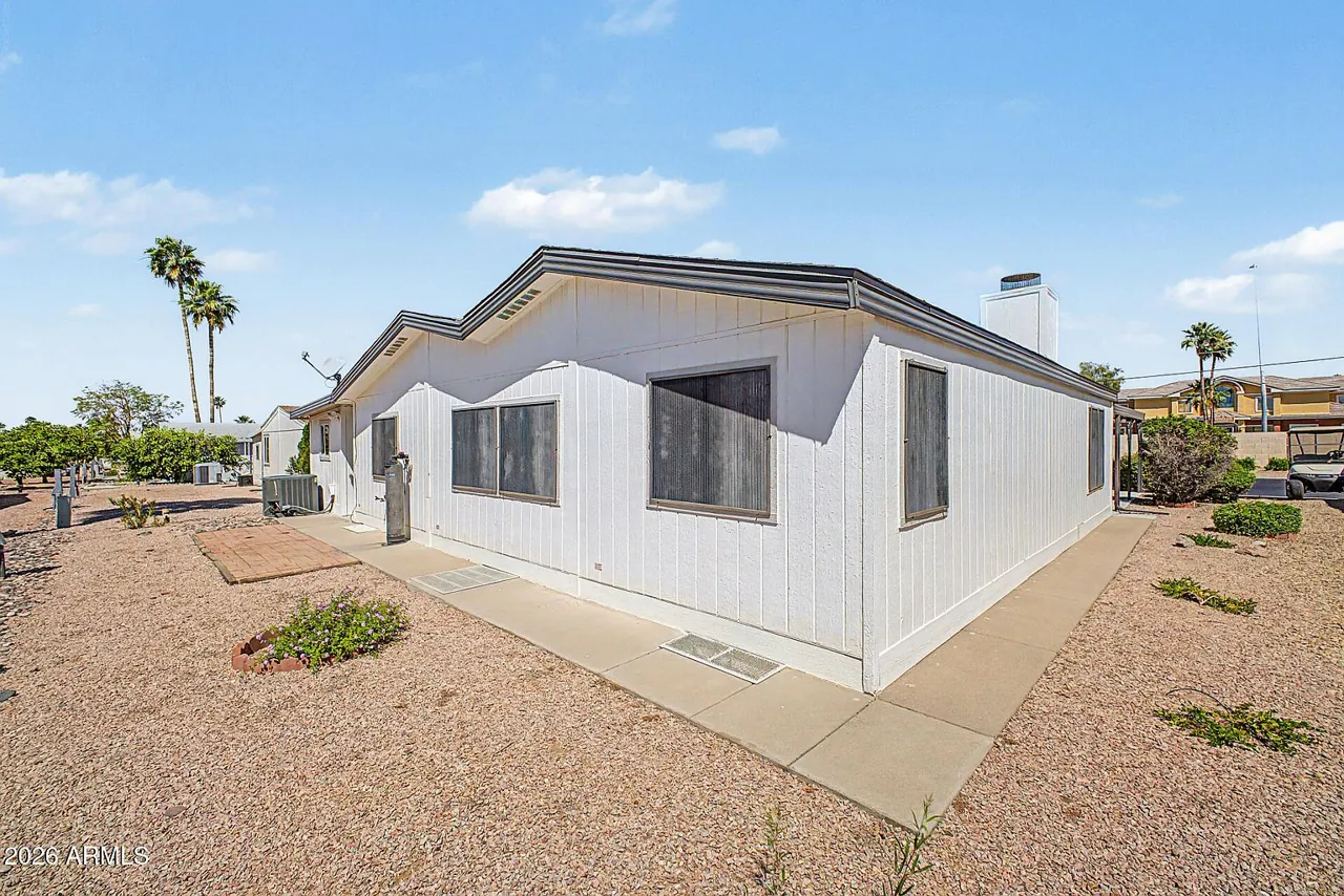 Side and rear exterior with gravel desert yard